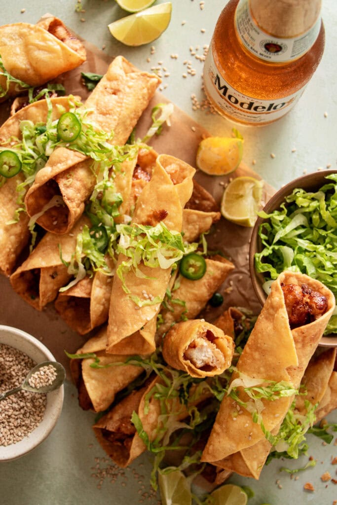 taquitos with chicken and pepper jack cheese topped with lettuce