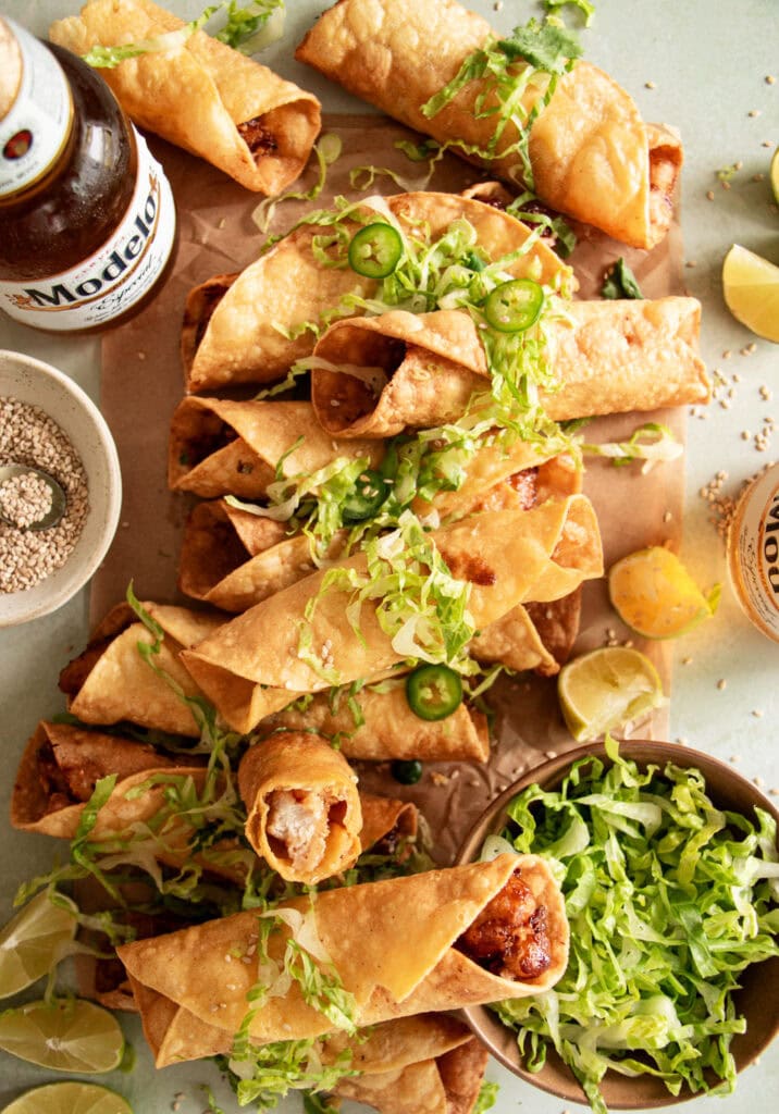 taquitos layered on parchment paper 