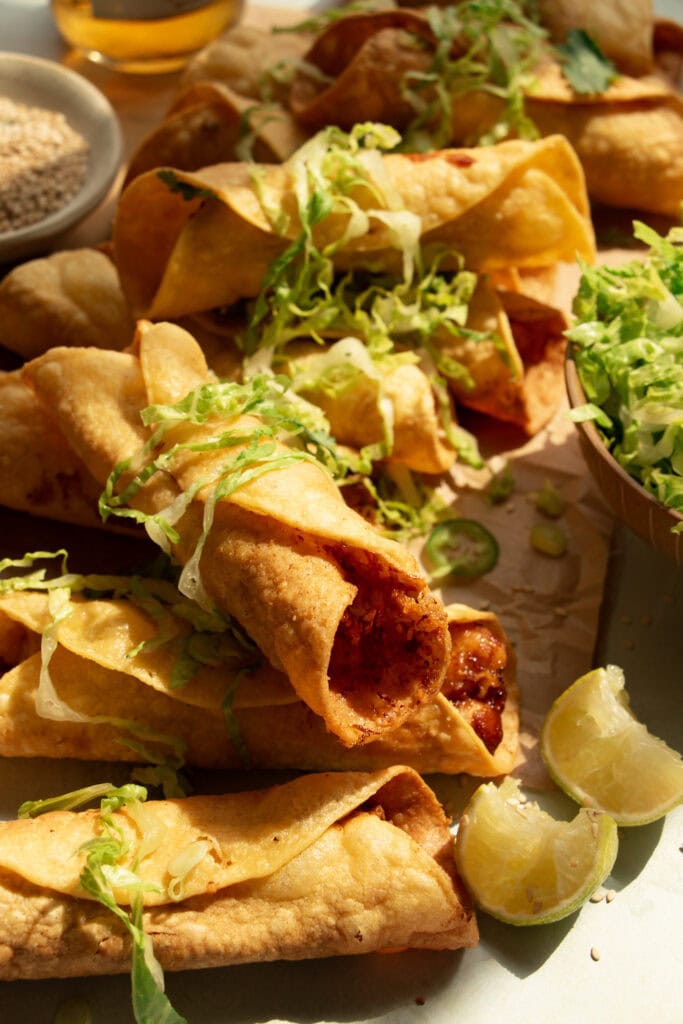 crispy taquitos topped with shredded lettuce 