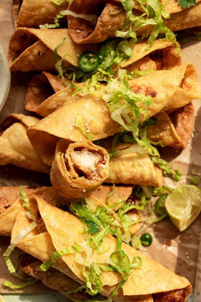 rolled chicken taquitos on parchment paper 