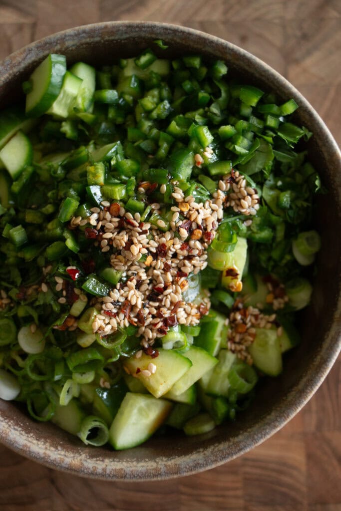 bowl with ingredients for the spicy cucumber salad
