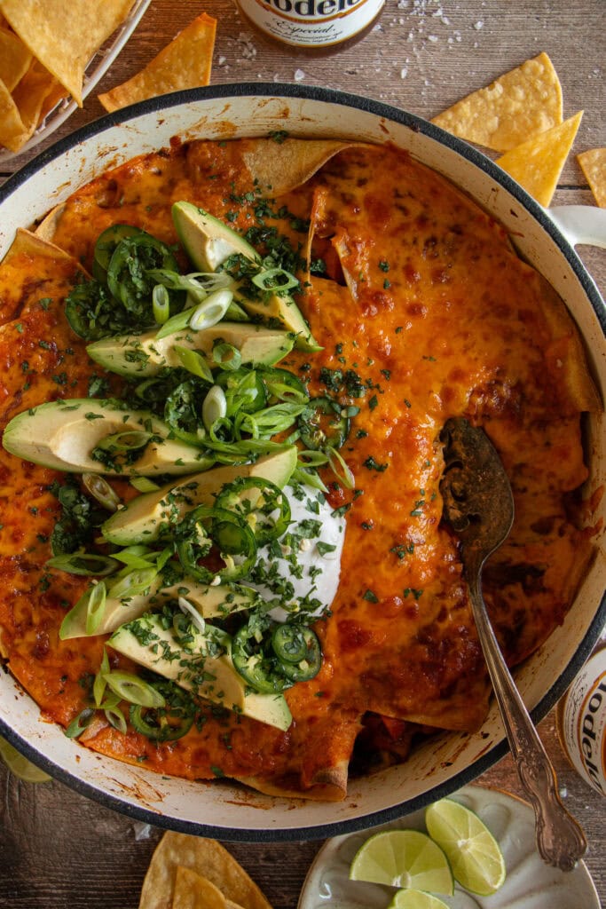 large skillet with baked vegetarian enchilada casserole