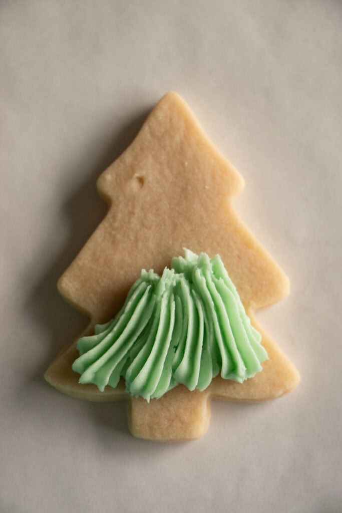 green frosting on a baked cookie