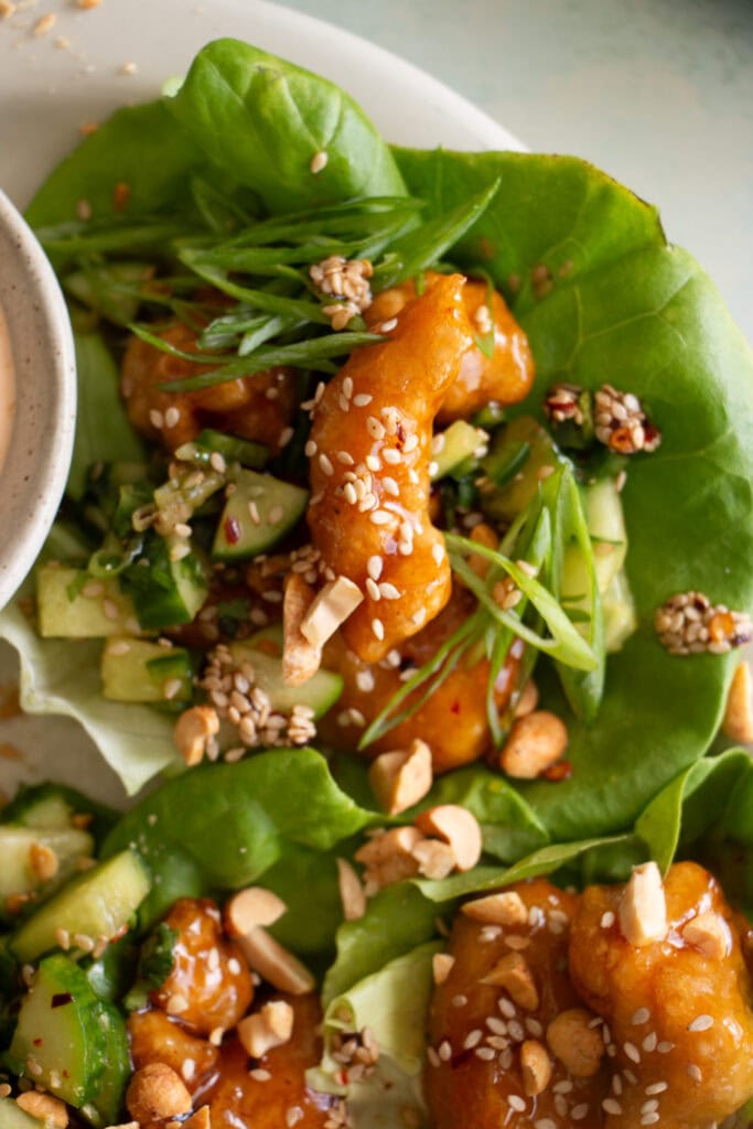 butter lettuce filled with crispy chicken and cucumber salad