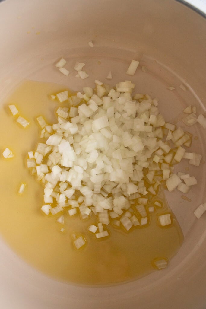 diced onion sautéing in a pan