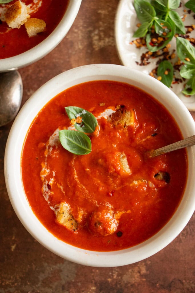homemade tomato soup with basil and croutons 