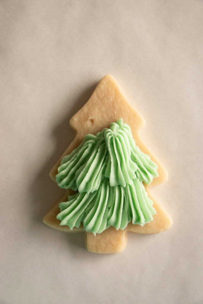 baked Christmas tree sugar cookie with buttercream frosting