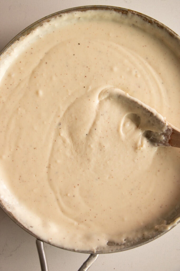 Saucepan with cheese sauce