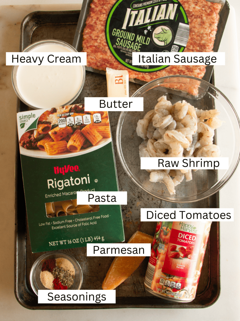 Sheet pan with ingredients needed to make the Cajun pasta 