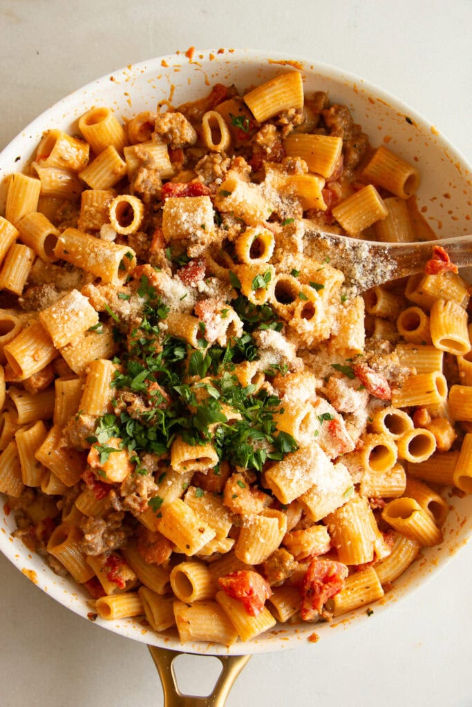 Tossed Cajun pasta topped with fresh parsley 
