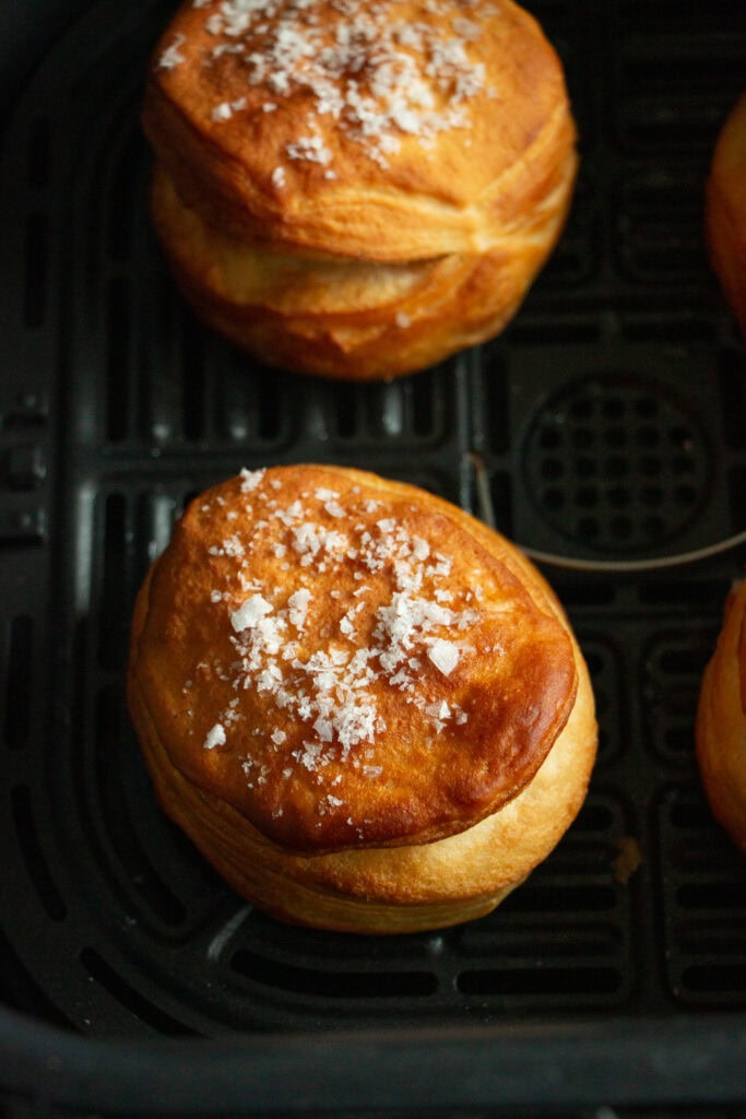 Fresh air fried biscuits in the air fryer basket 