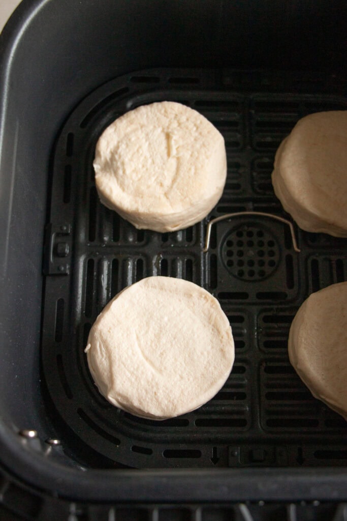uncooked biscuits in the air fryer basket 