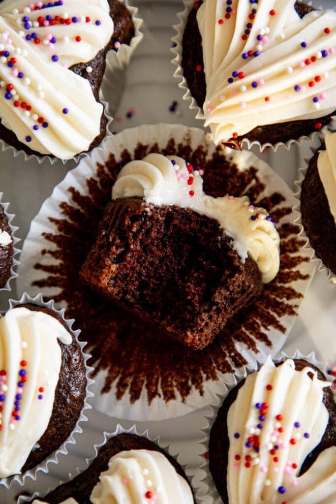 chocolate heart cupcakes with vanilla buttercream on parchment paper
