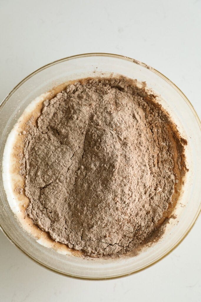 Mixing bowl with dry ingredients added into the wet ingredients