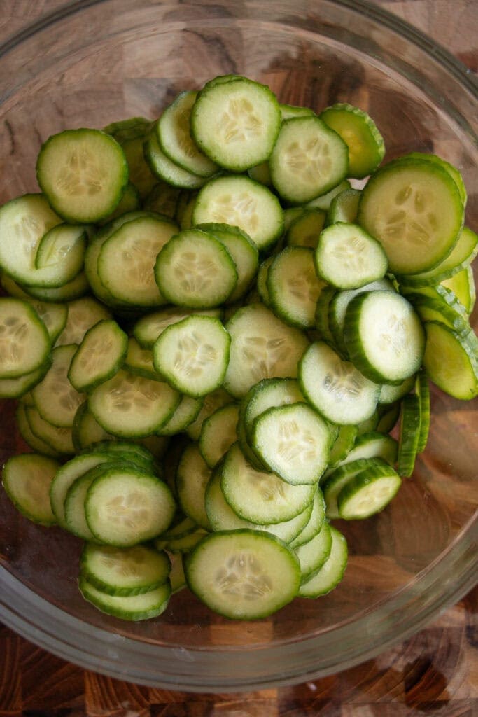 slice cucumbers in a bowl