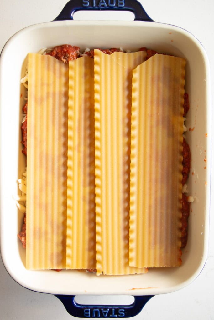 lasagna noodles on top of sauce