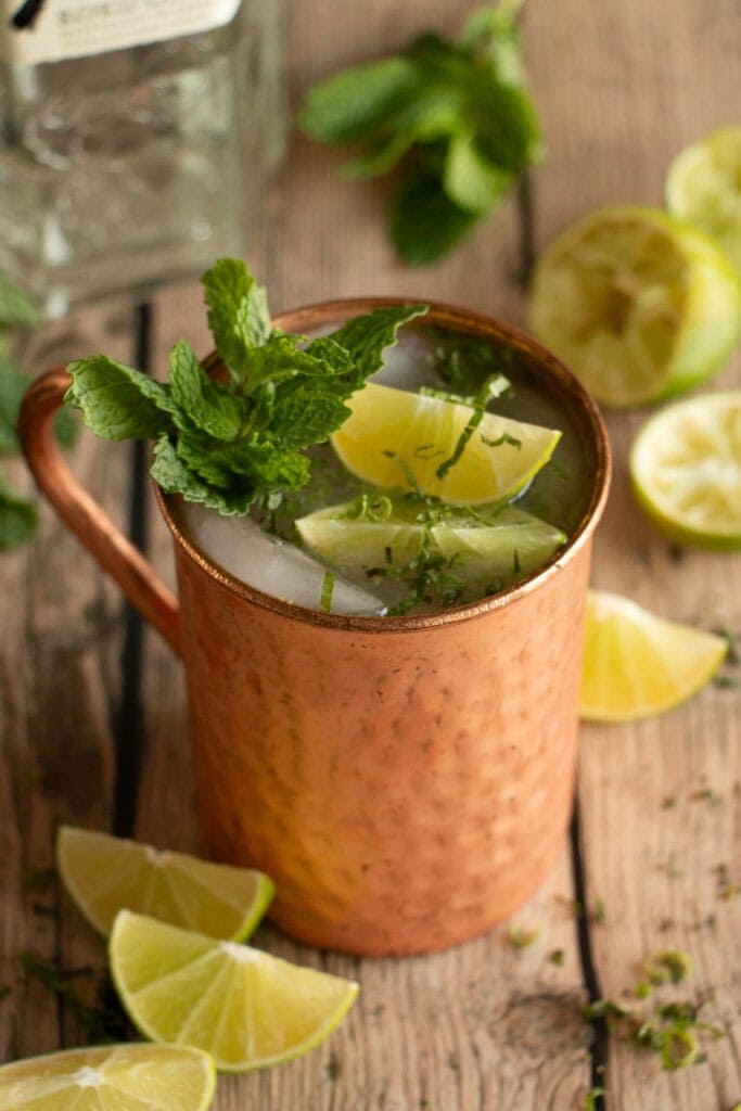 Chilled copper mug with gin and ginger beer.