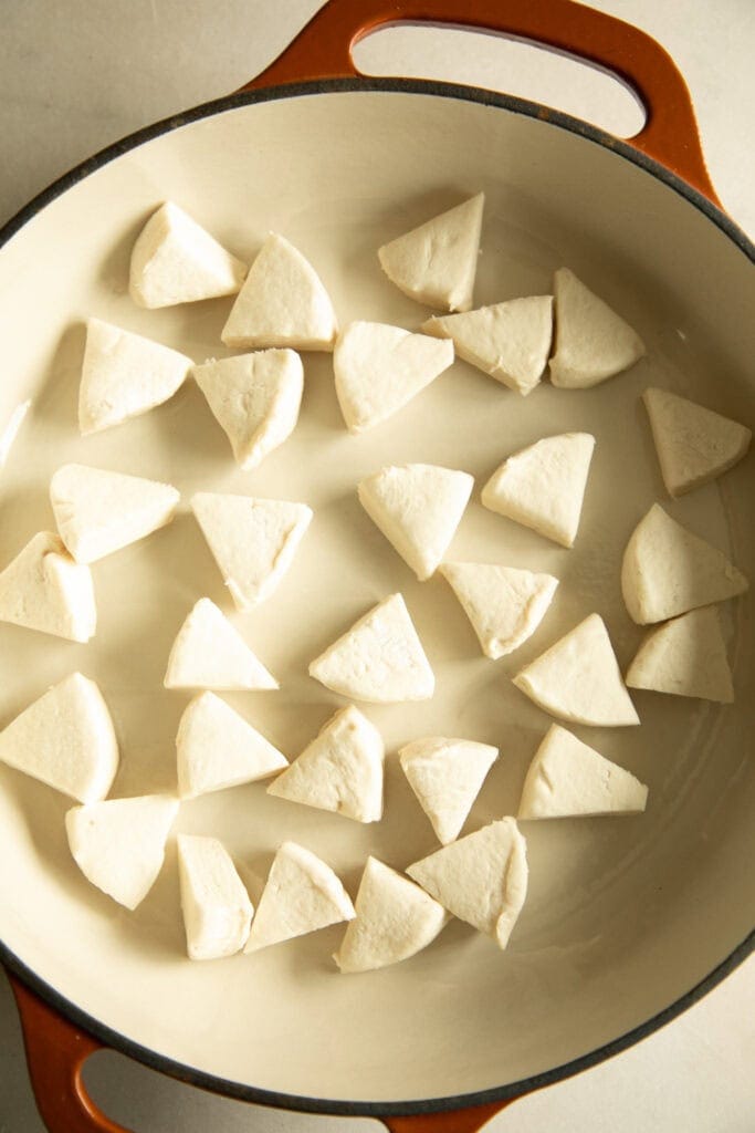 Casserole dish with chopped biscuit dough