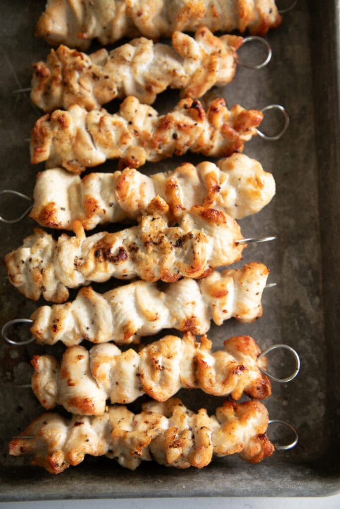 Air fried chicken skewers on a sheet pan