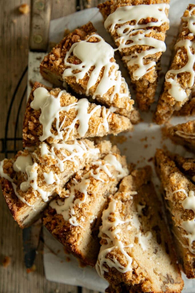 Sliced coffee cake with maple glaze on a wire rack 