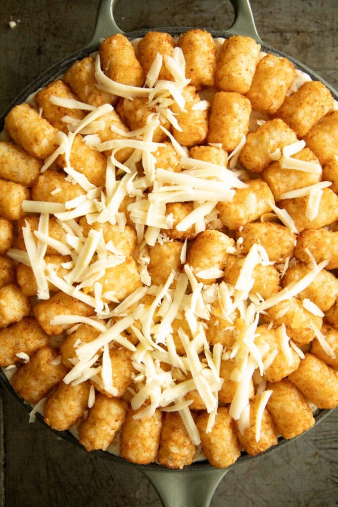 cheese sprinkled over baked casserole