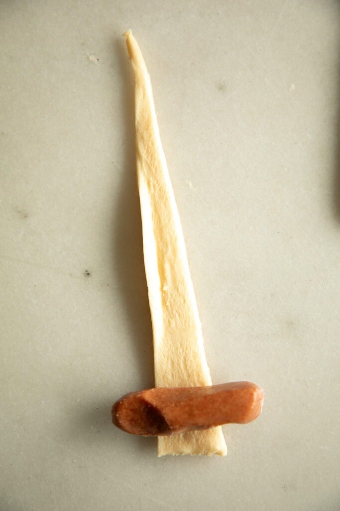 little smokie on a piece of crescent roll dough