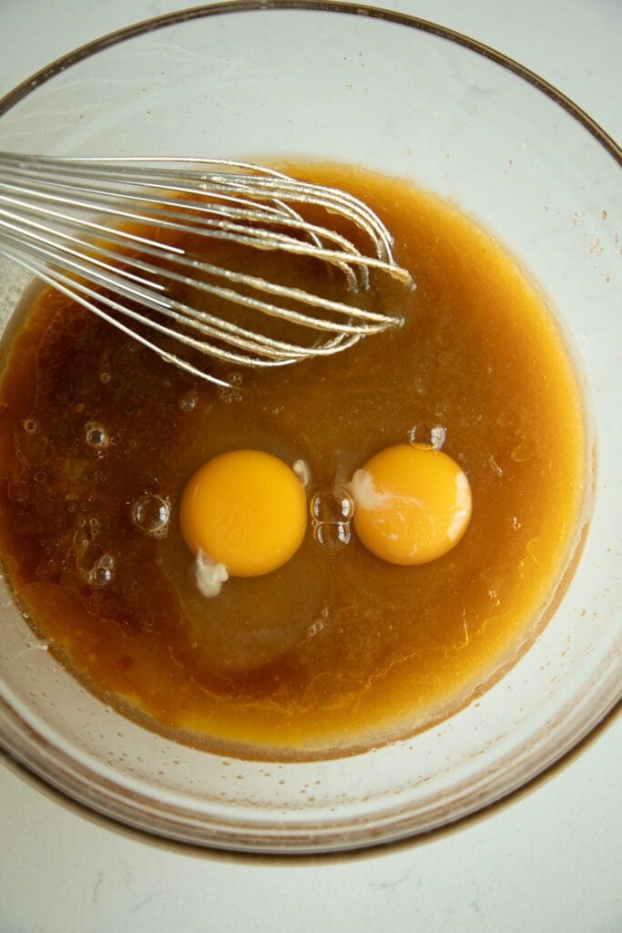 mixing bowl with eggs and butter sugar mixture