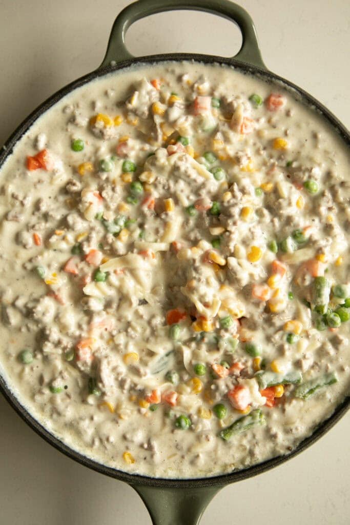 tater tot casserole mixture in a skillet