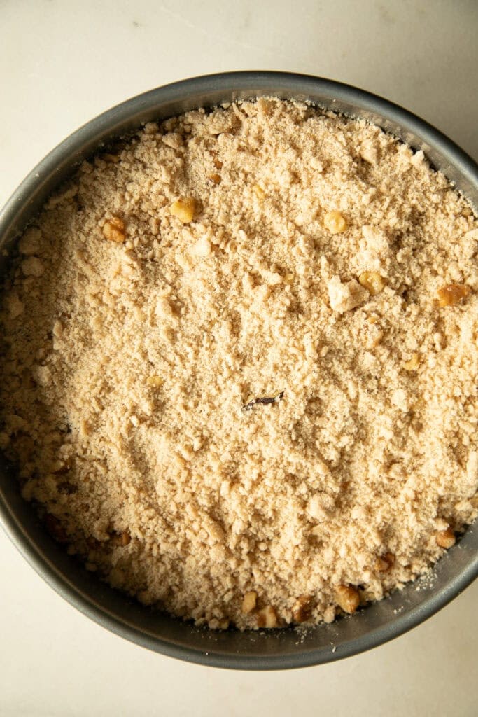 Baking pan with cake batter topped with streusel 