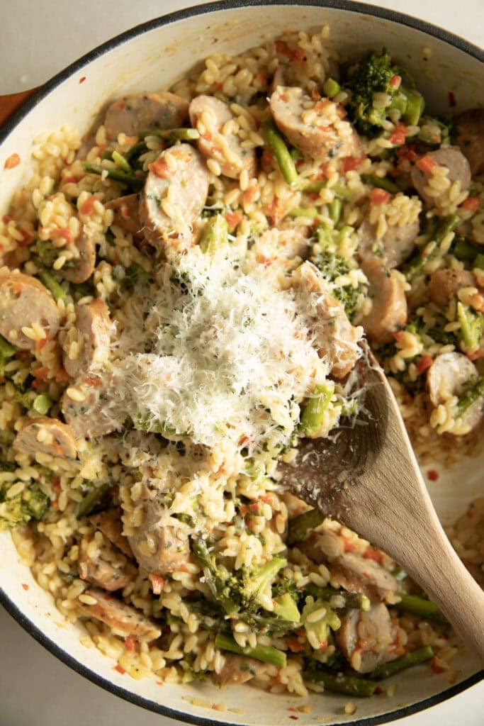 Parmesan grated into the orzo skillet