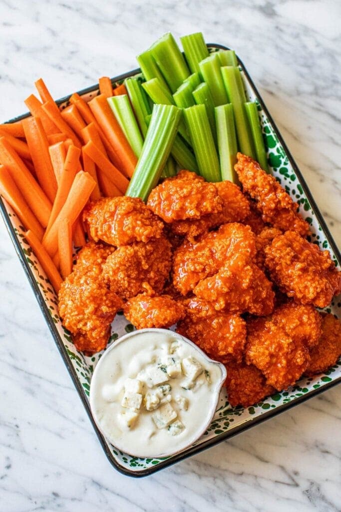 Saucy buffalo chicken bites on a platter