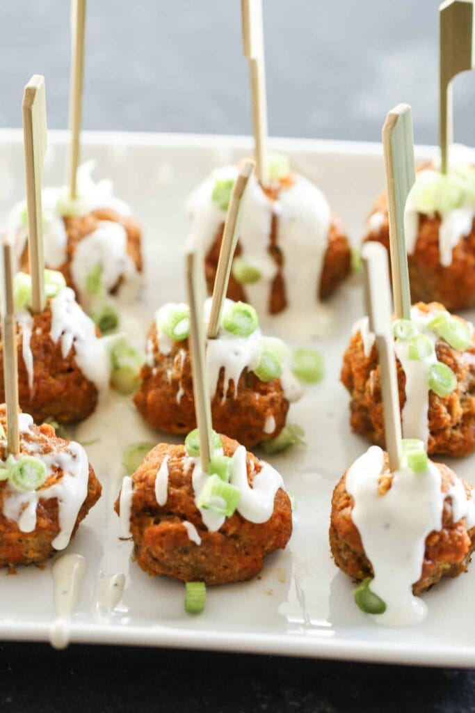 Buffalo chicken meatballs with blue cheese dressing and skewers