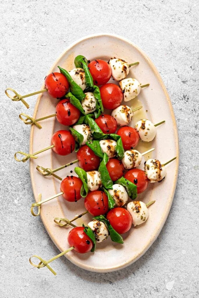 Caprese skewers on a platter