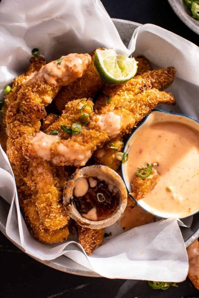 Crispy coconut chicken fingers with bang bang sauce