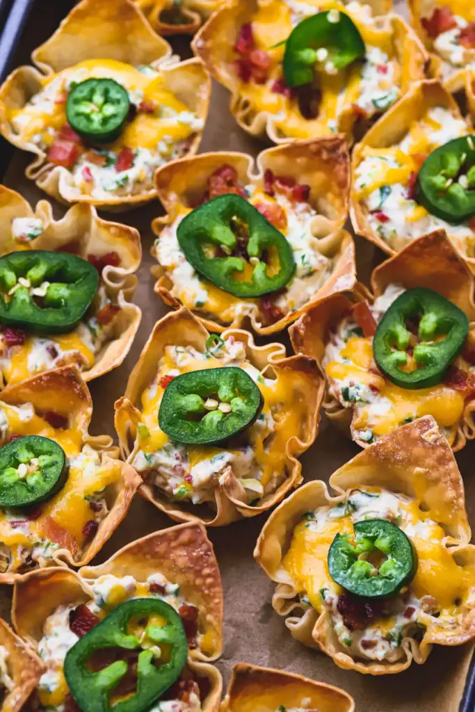 Wontons cups filled with jalapeno popper filling