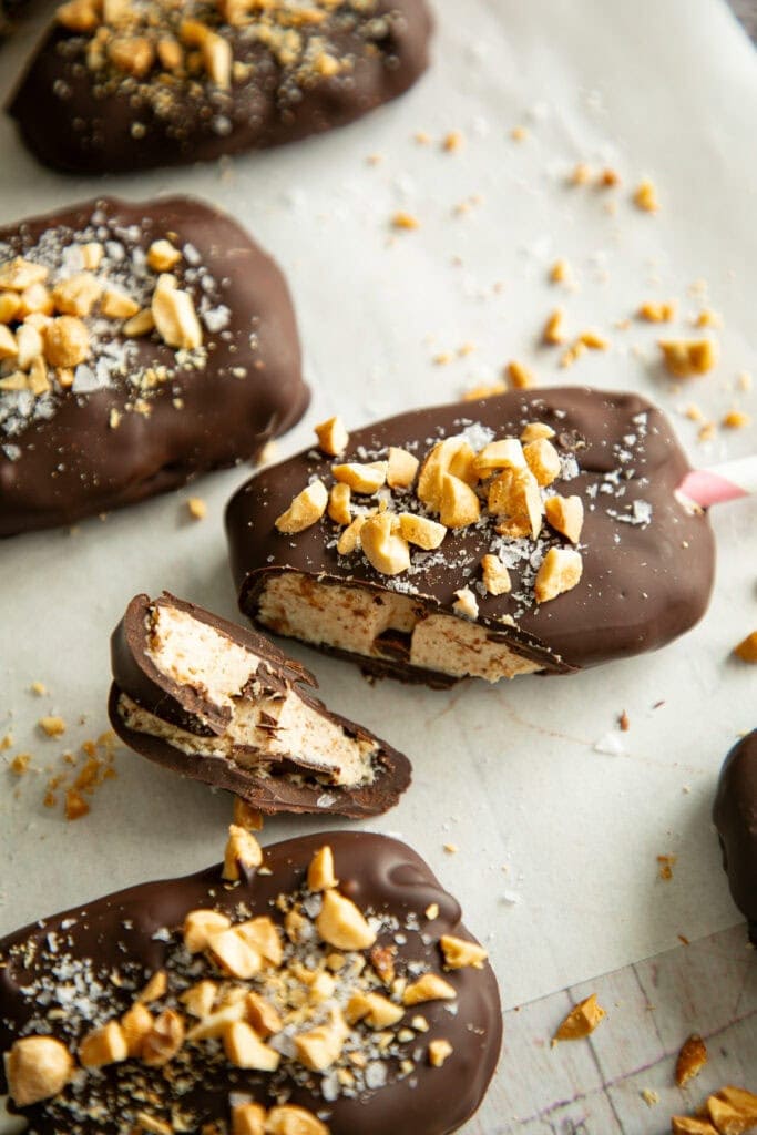 Frozen yogurt Buster bars coated in chocolate and topped with chopped peanuts