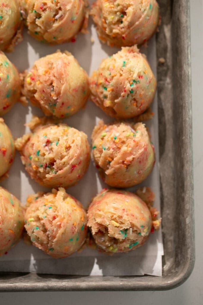 scoops or cookie dough on a sheet pan