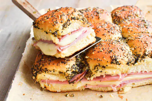 Ham and cheese sliders on a spatula