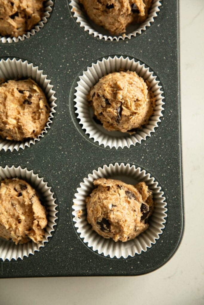 scooped muffins in a tin
