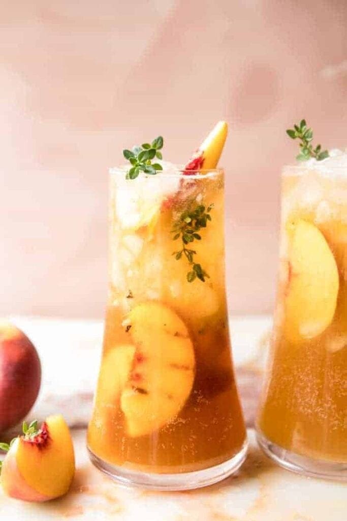 Glasses of ginger peach thyme smash