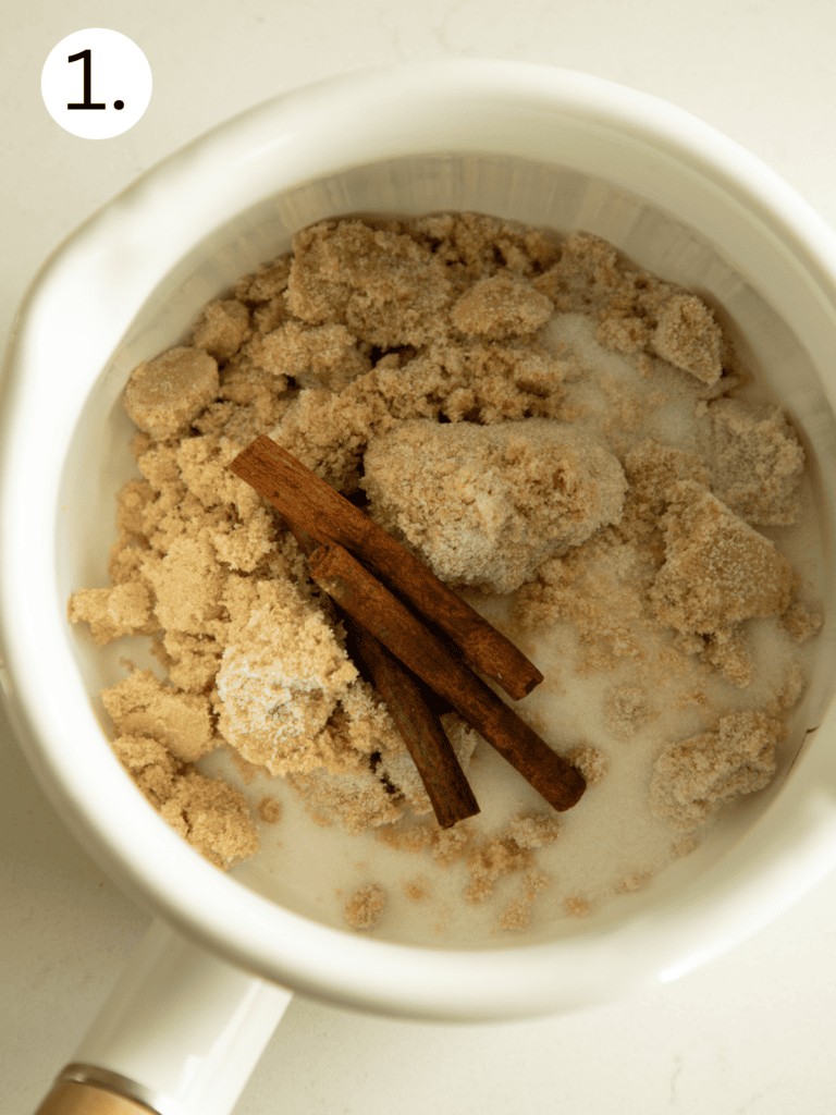 brown sugar and granulated sugar with cinnamon sticks in a pan