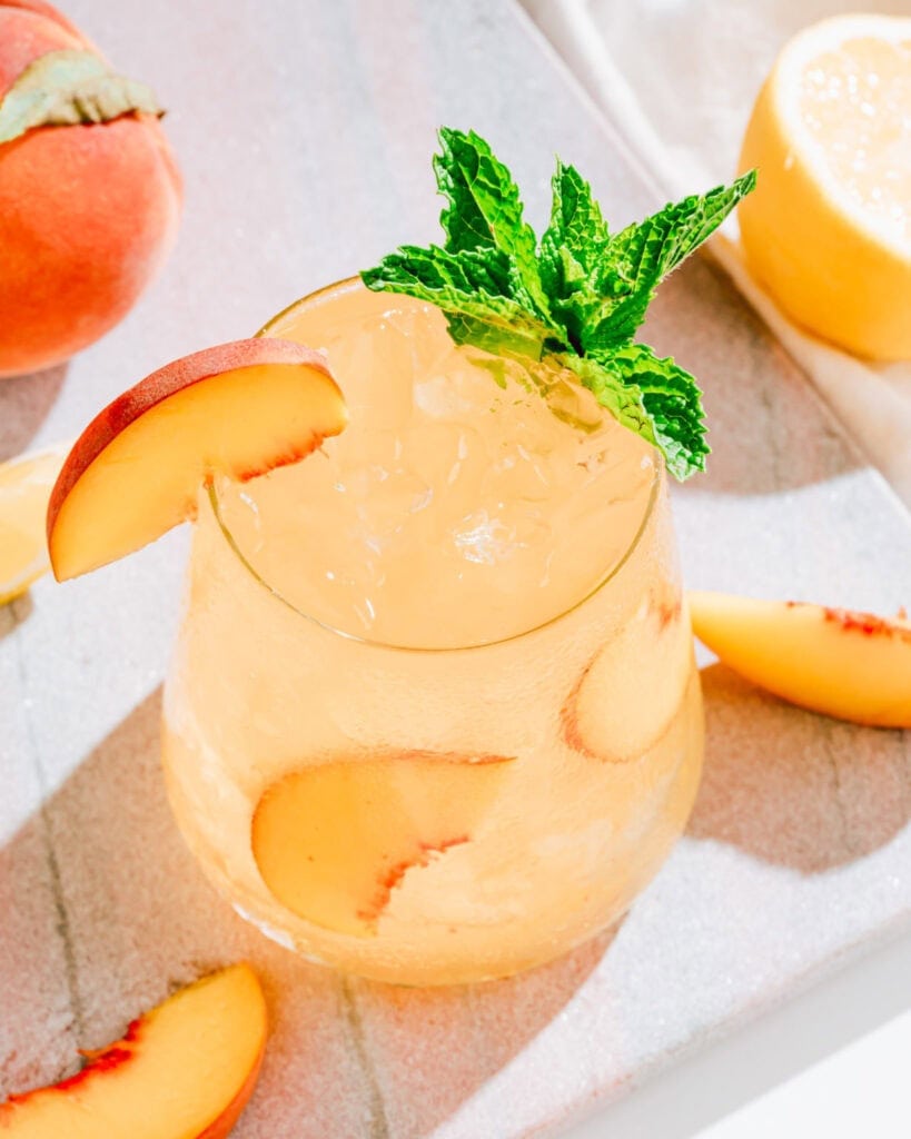 Sparking ginger peach whiskey cocktail