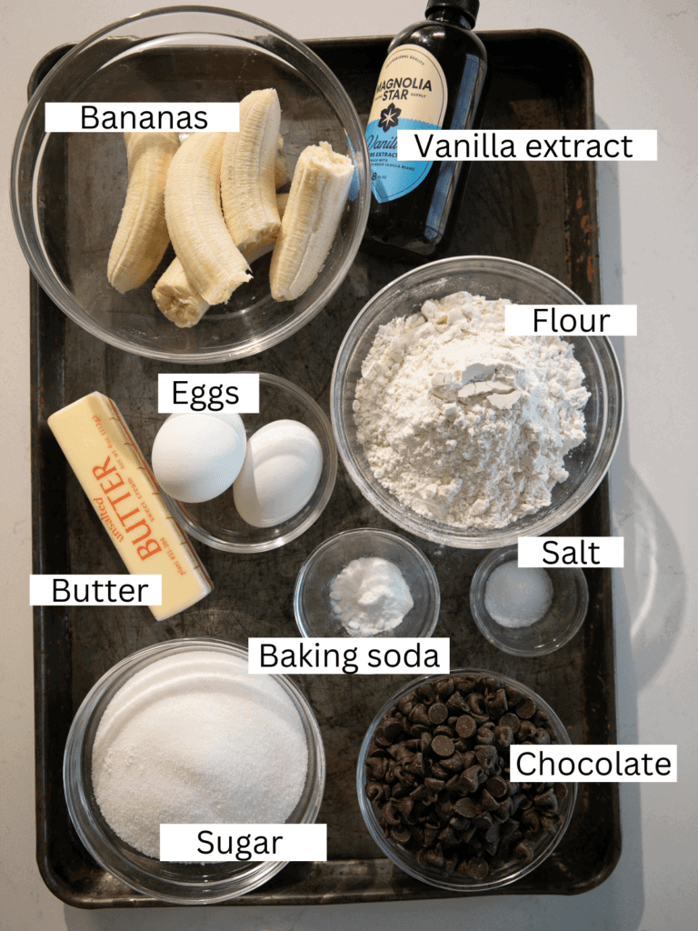portioned banana bread ingredients on a sheet pan