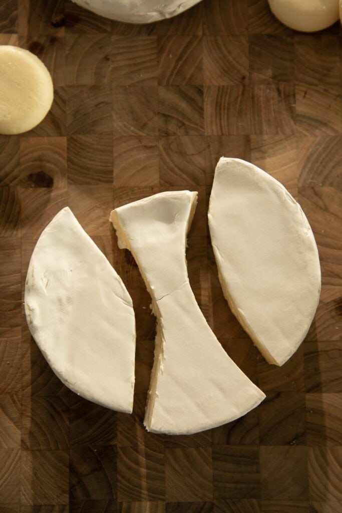 Bunny ears cut out of a round of brie cheese