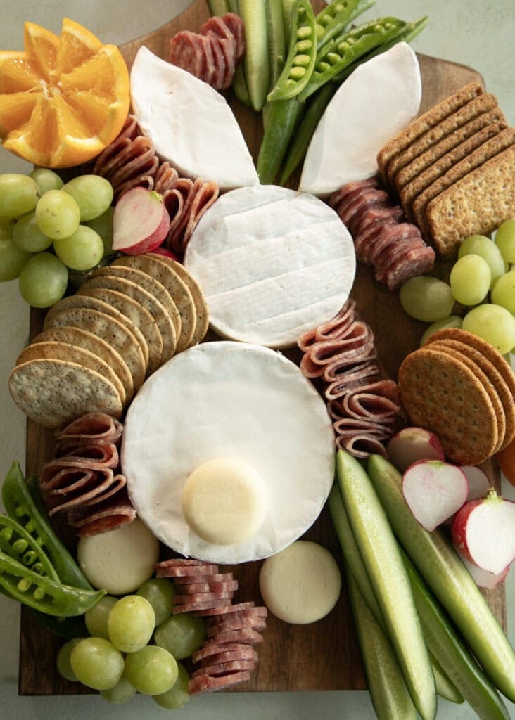 Loaded charcuterie board, with cheese bunny, veggies, and crackers