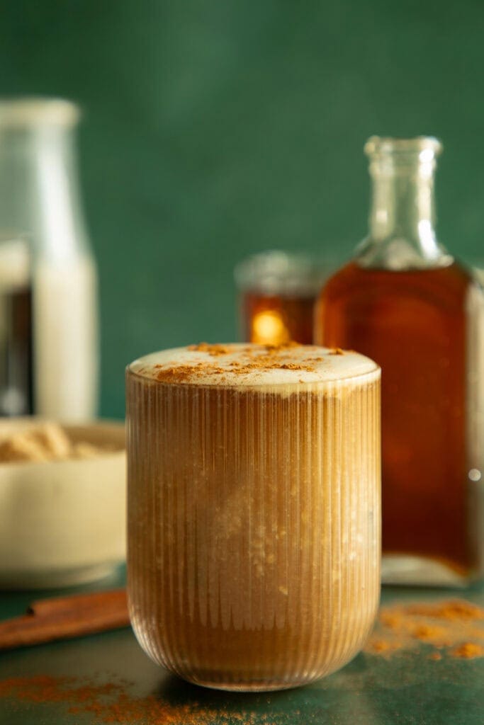 cup of iced latte with cinnamon coffee syrup