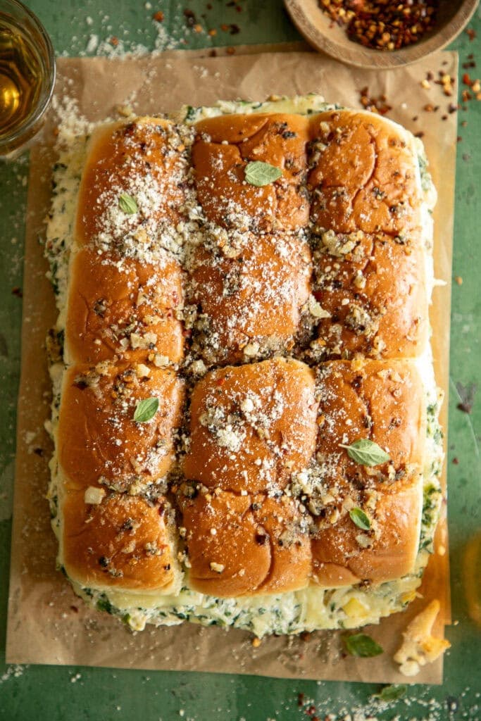 sleeve of sweet Hawaiian rolls loaded with spinach and artichoke dip and baked until golden brown 