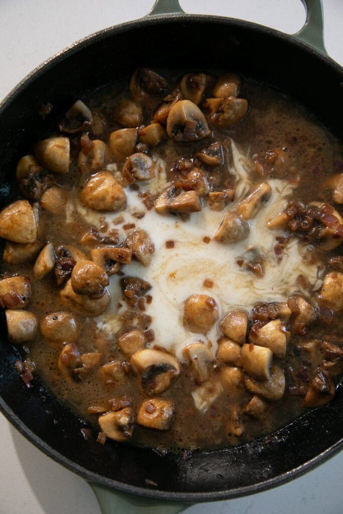 milk mixing into the skillet pan sauce
