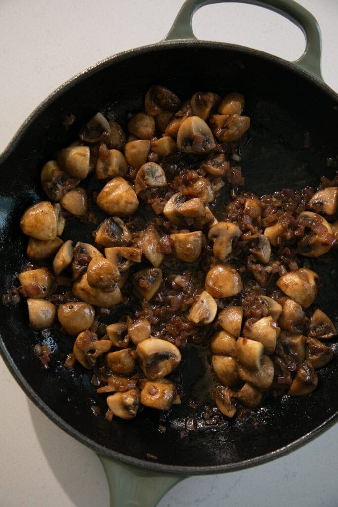 Sautéed onions and mushrooms in a large skillet