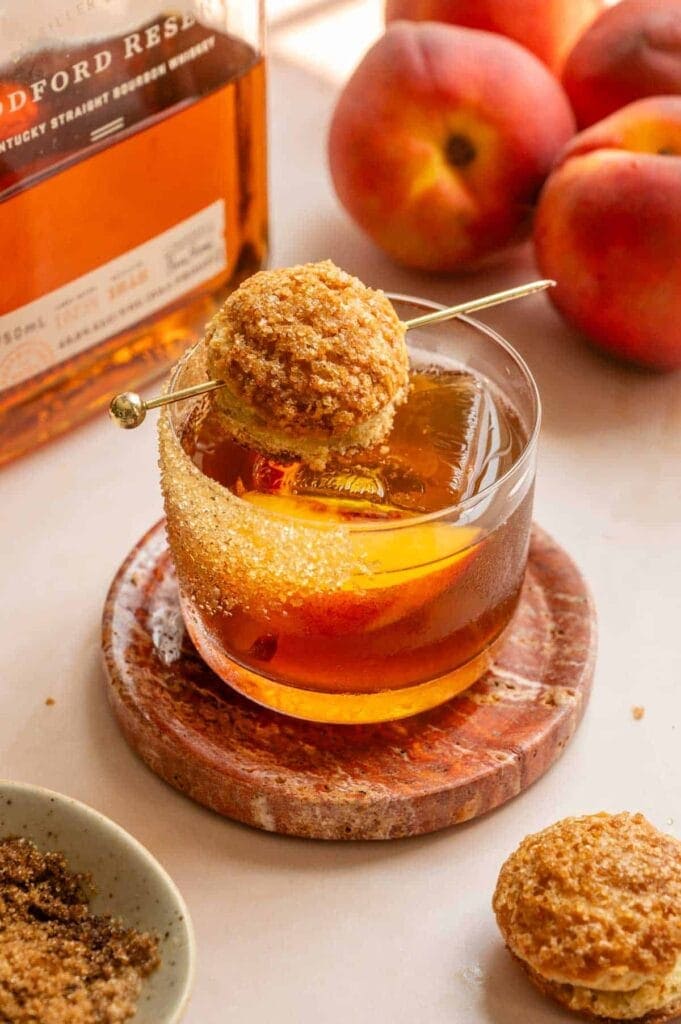 Whiskey cocktail topped with a little biscuit